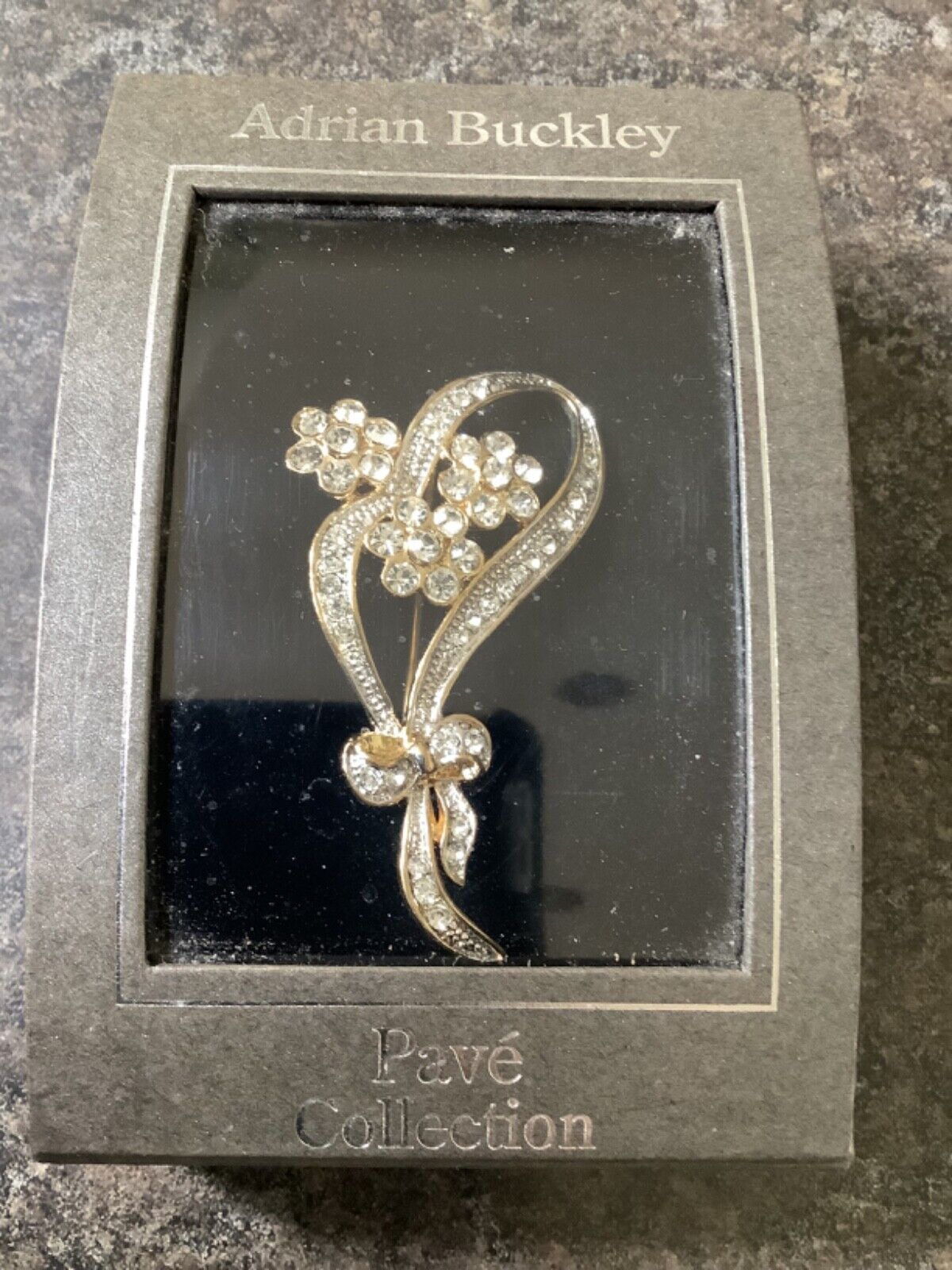 Adrian Buckley Pave Collection gold tone crystal flower on bow brooch