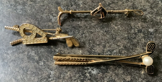 3 gold tone brooches faux pearl and 19th hole golf clubs plus horse and crop