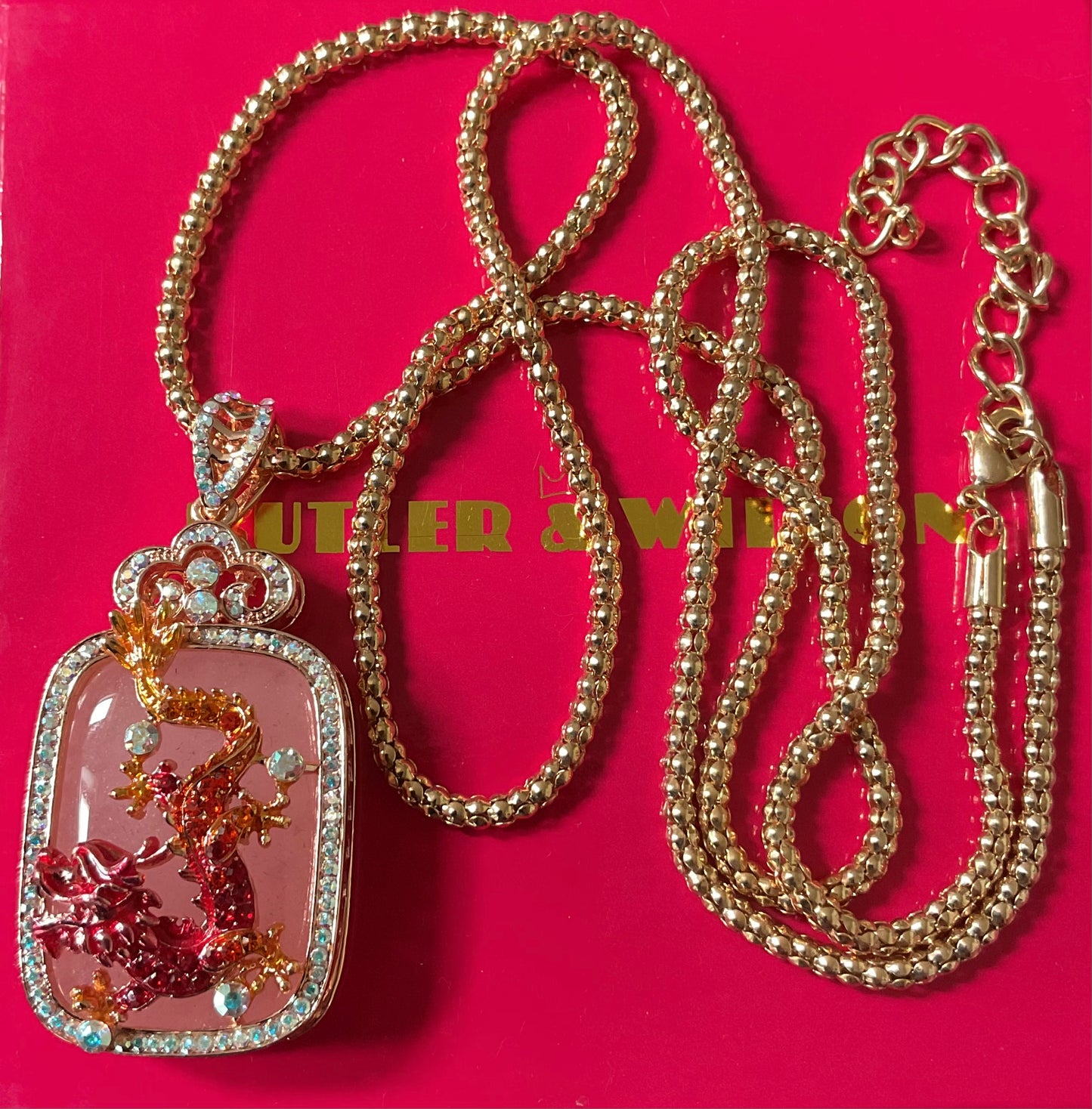 Butler and Wilson Chinese Dragon necklace with pink stone, crystals and enamel in rose gold tone with box