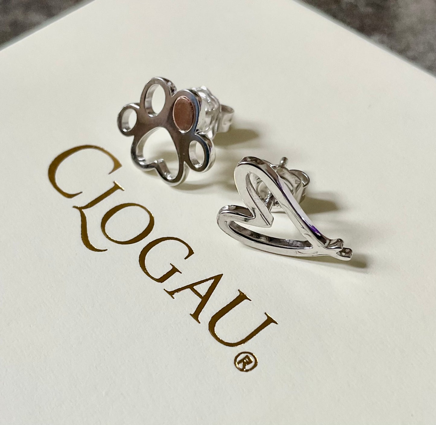 Clogau Paw Prints on my Heart stud earrings in silver and rose gold