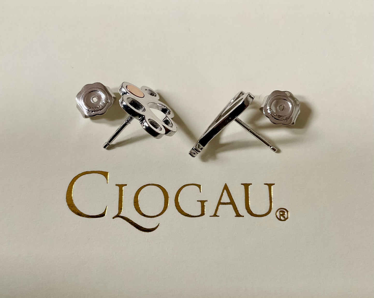 Clogau Paw Prints on my Heart stud earrings in silver and rose gold