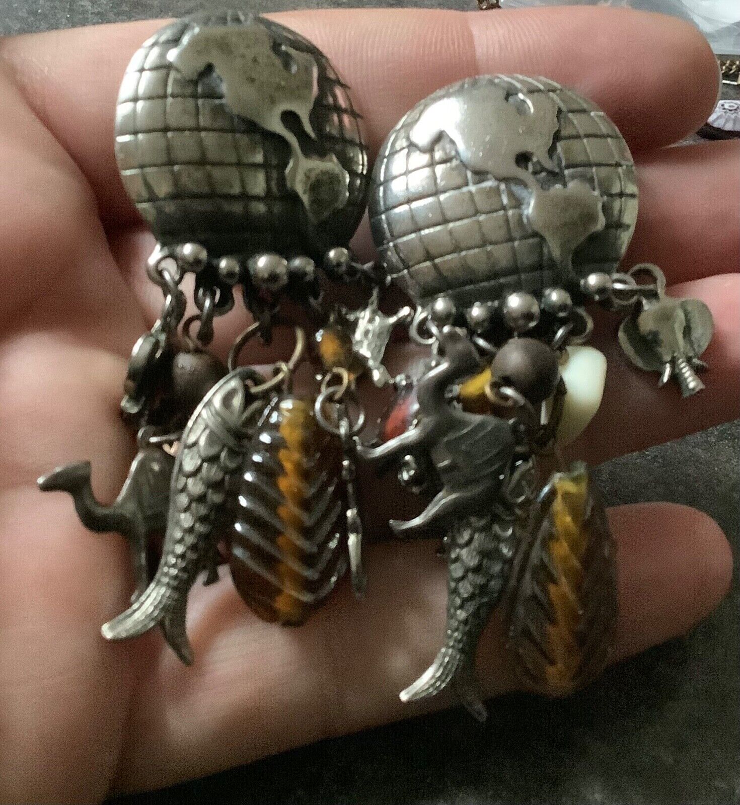 large vintage silver tone world globe earth clip earrings with dangling animals