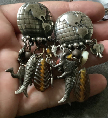 large vintage silver tone world globe earth clip earrings with dangling animals