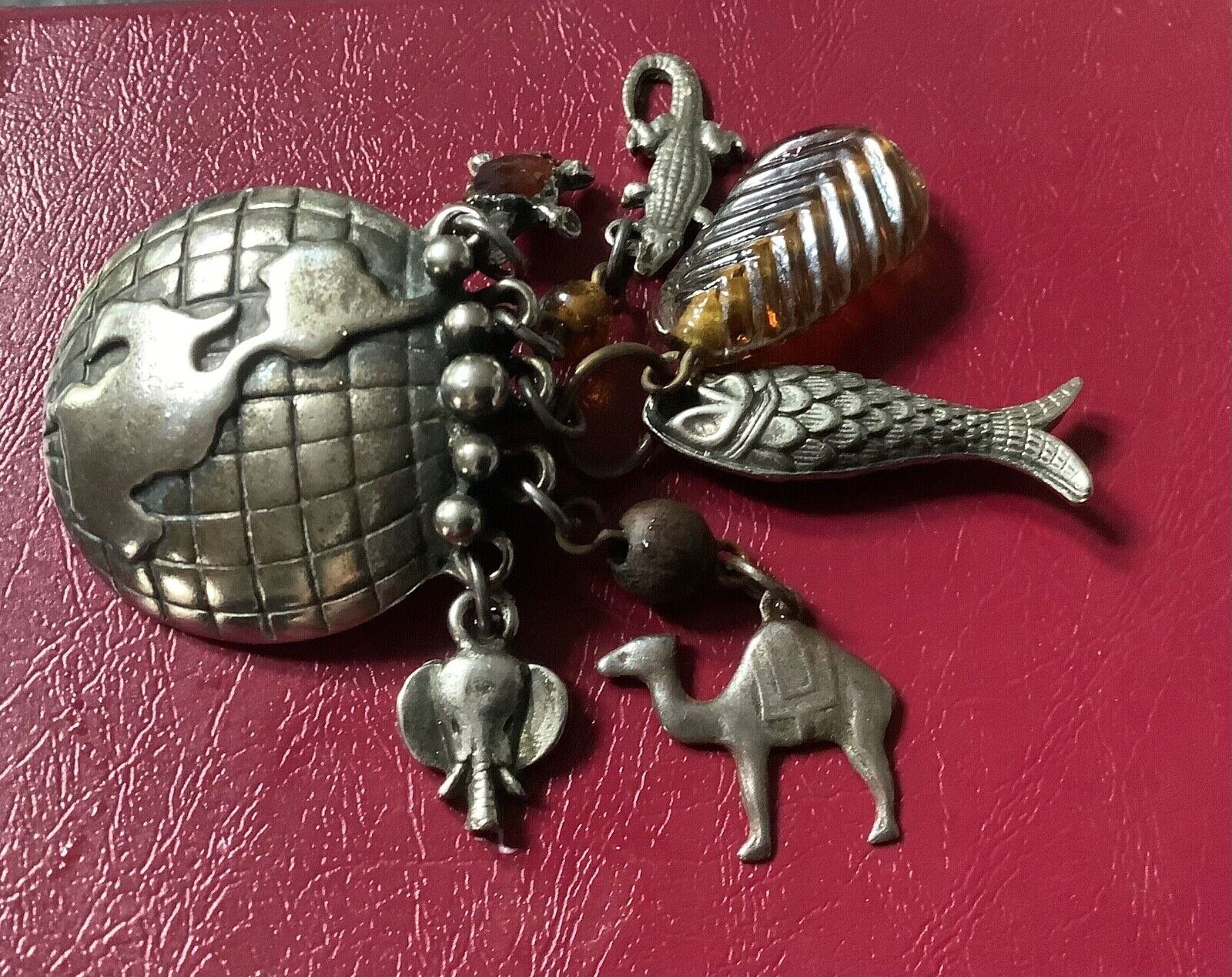 large vintage silver tone world globe earth clip earrings with dangling animals