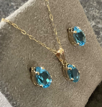 10K Blue topaz pendant 16” necklace and stud earring set yellow gold