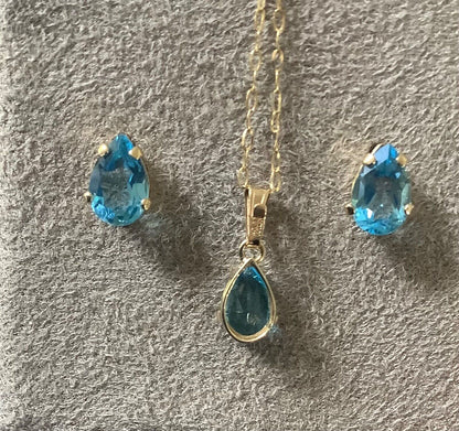 10K Blue topaz pendant 16” necklace and stud earring set yellow gold