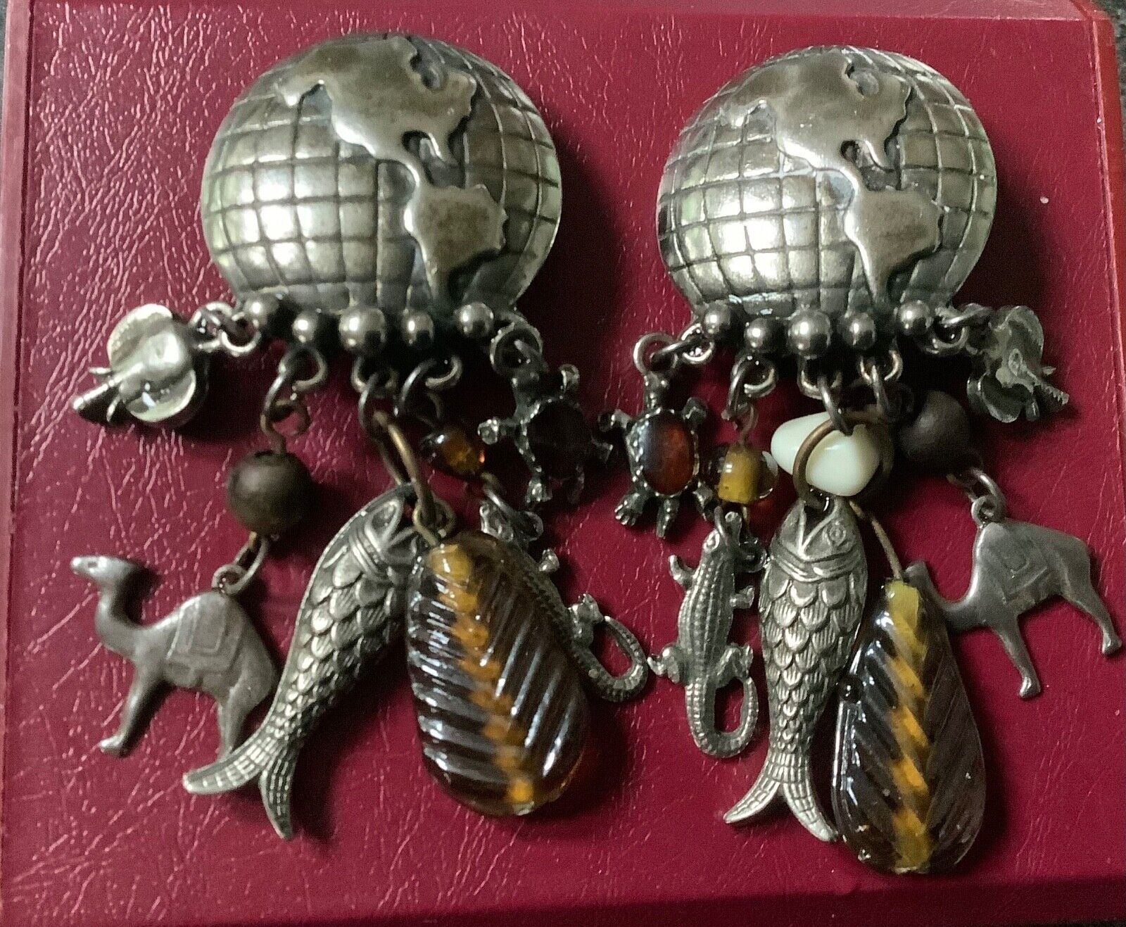 large vintage silver tone world globe earth clip earrings with dangling animals