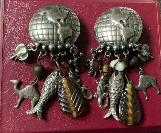 large vintage silver tone world globe earth clip earrings with dangling animals