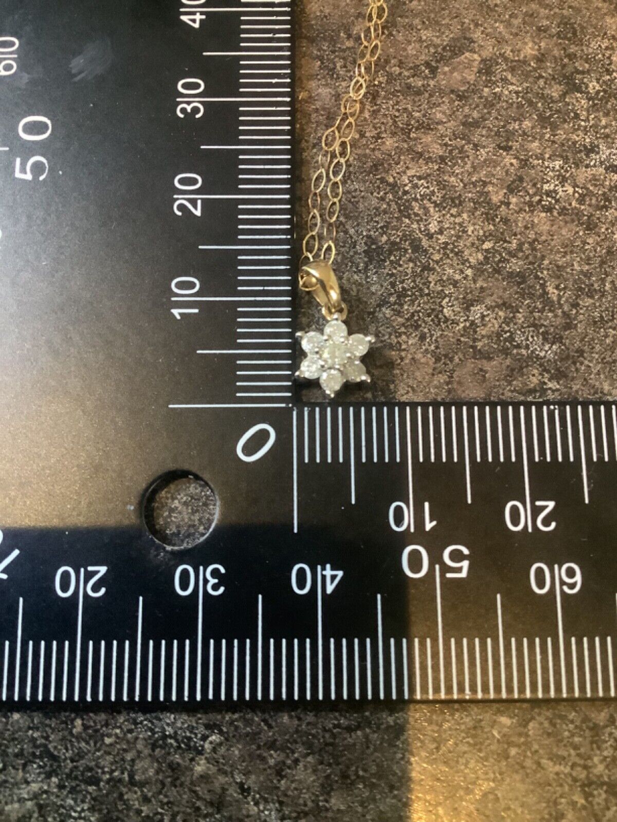 9ct Diamond floral cluster pendant on 16" fine trace chain yellow gold