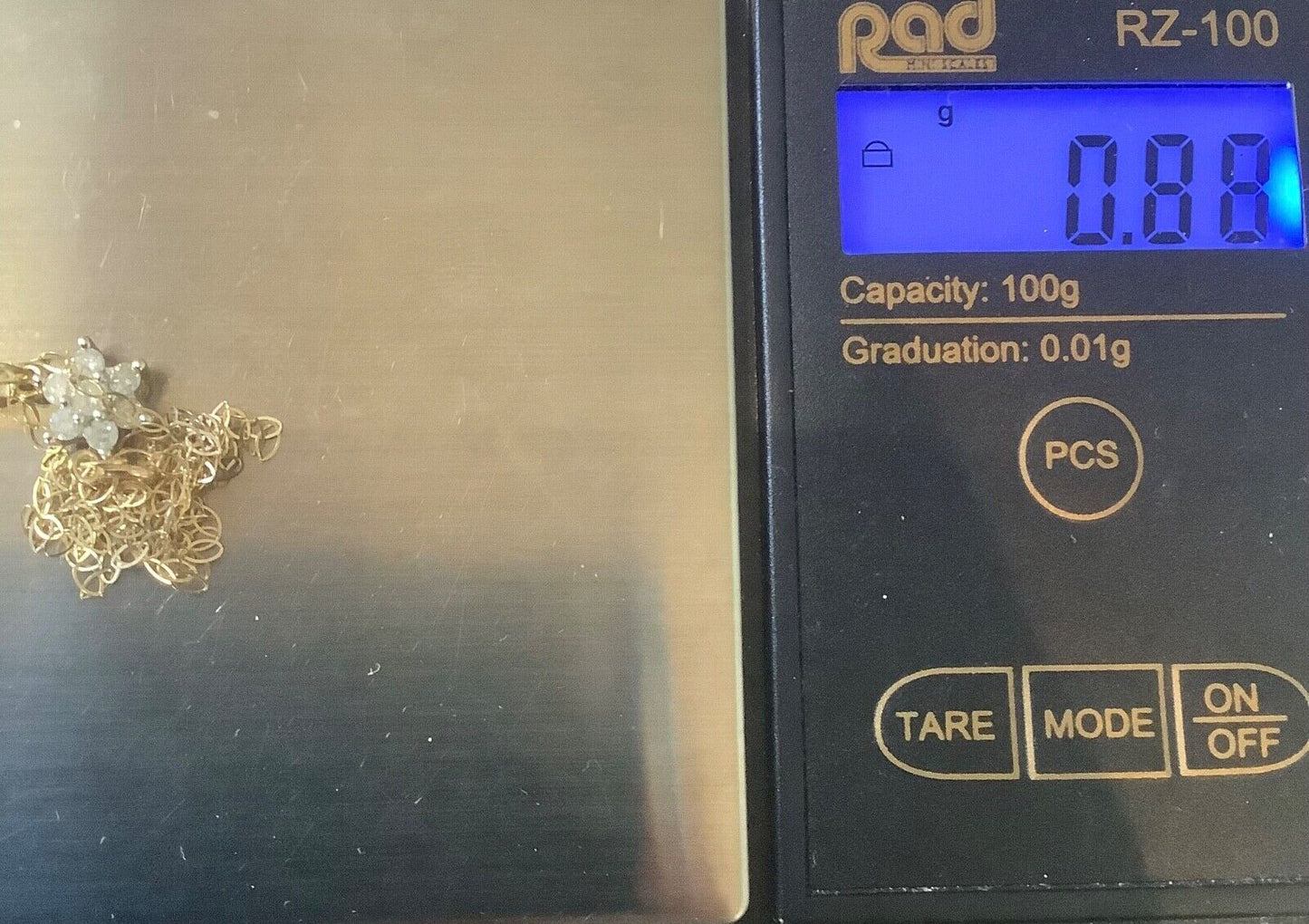 9ct Diamond floral cluster pendant on 16" fine trace chain yellow gold