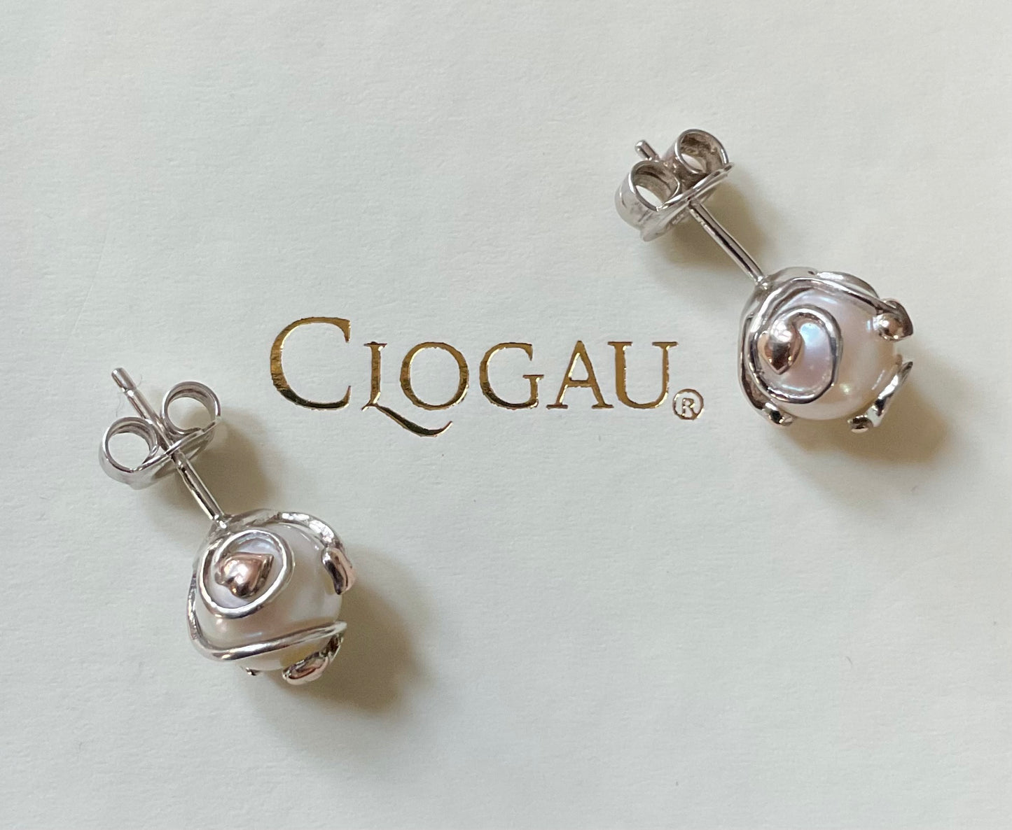Clogau Caged Pearl stud earrings and Caged Pearl necklace in silver and rose gold