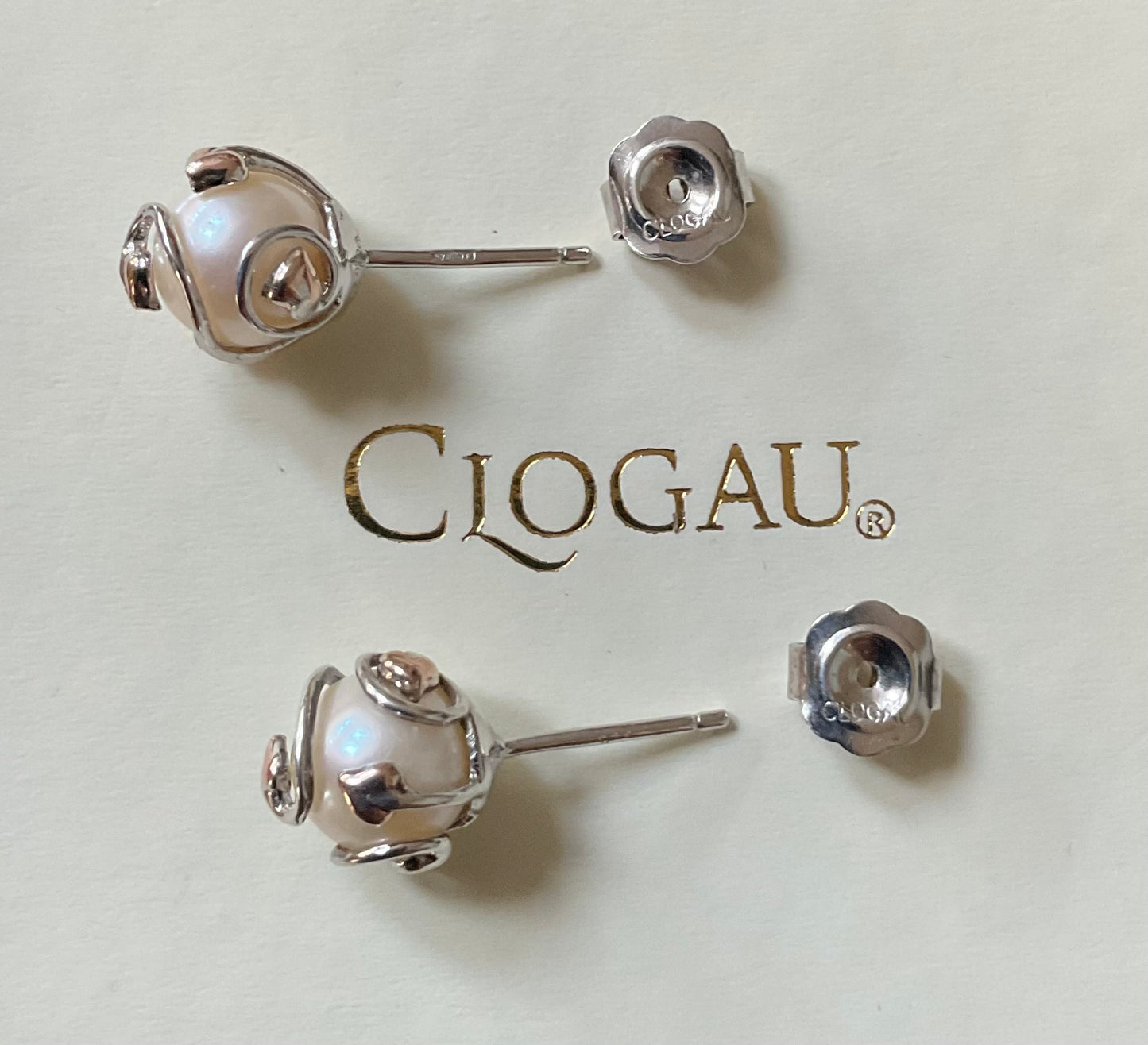 Clogau Caged Pearl stud earrings and Caged Pearl necklace in silver and rose gold