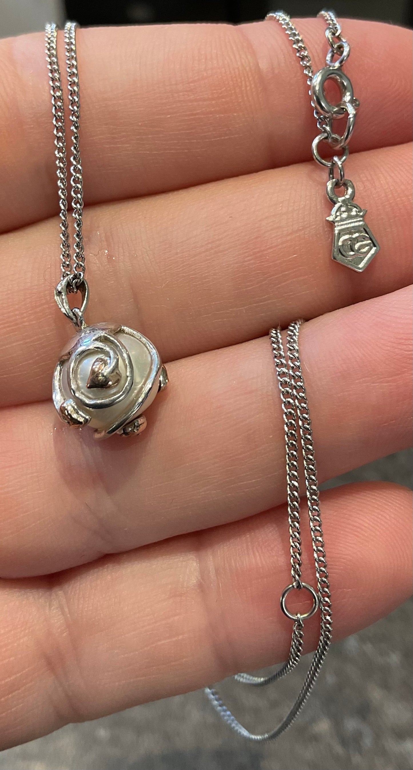 Clogau Caged Pearl stud earrings and Caged Pearl necklace in silver and rose gold