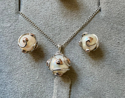 Clogau Caged Pearl stud earrings and Caged Pearl necklace in silver and rose gold