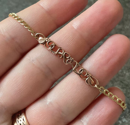 Vintage Clogau 9ct Cariad bracelet with safety padlock in yellow and rose gold
