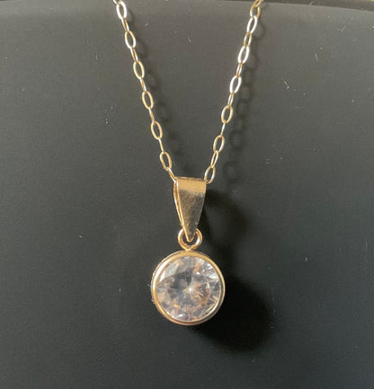 IBB 9ct Cubic Zirconia round bezel set solitaire pendant on 16" fine trace chain