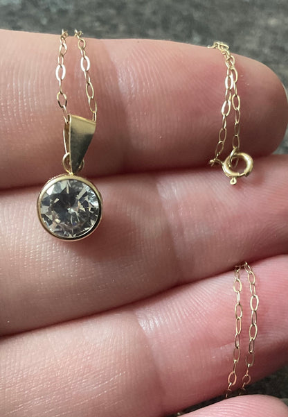 IBB 9ct Cubic Zirconia round bezel set solitaire pendant on 16" fine trace chain