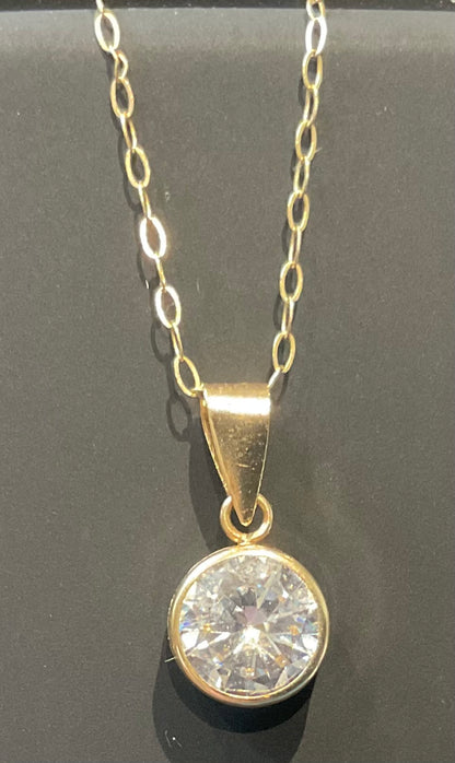 IBB 9ct Cubic Zirconia round bezel set solitaire pendant on 16" fine trace chain