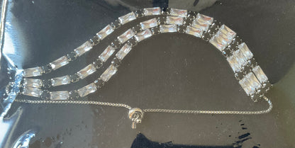 Butler and Wilson black and clear crystal triple row silver tone adjustable bracelet sealed in original box