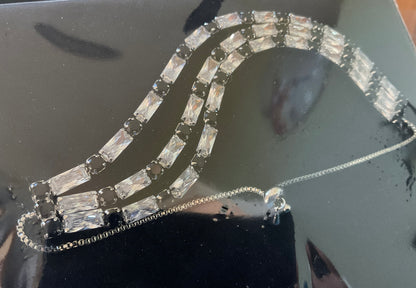 Butler and Wilson black and clear crystal triple row silver tone adjustable bracelet sealed in original box