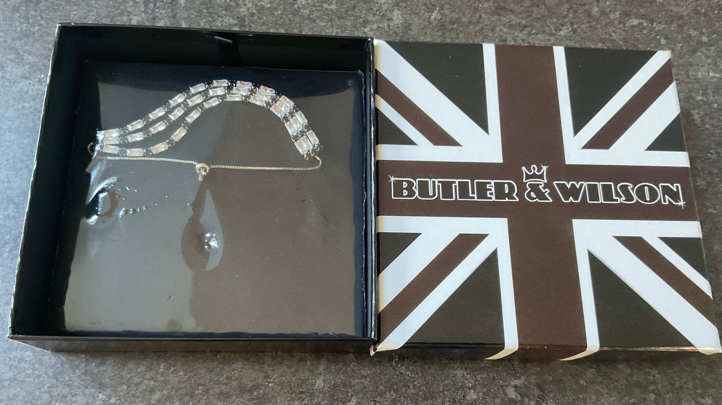 Butler and Wilson black and clear crystal triple row silver tone adjustable bracelet sealed in original box