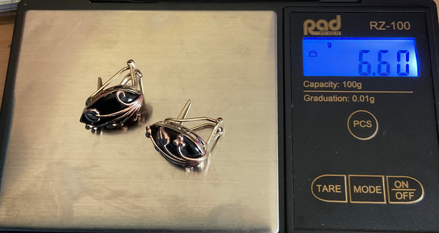 Clogau 9ct Black Onyx Nightfall stud earrings in yellow and rose gold with post and clip for pierced ears