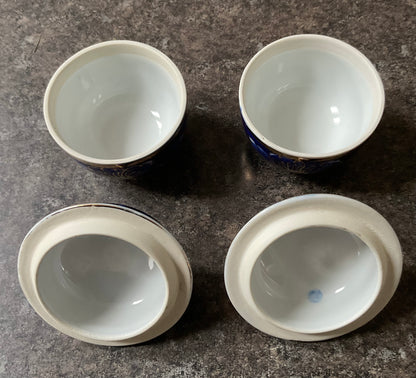 Pair of Vintage Thai Benjarong hand painted lidded pots in blue and white with gold flowers and accents 7x9cm