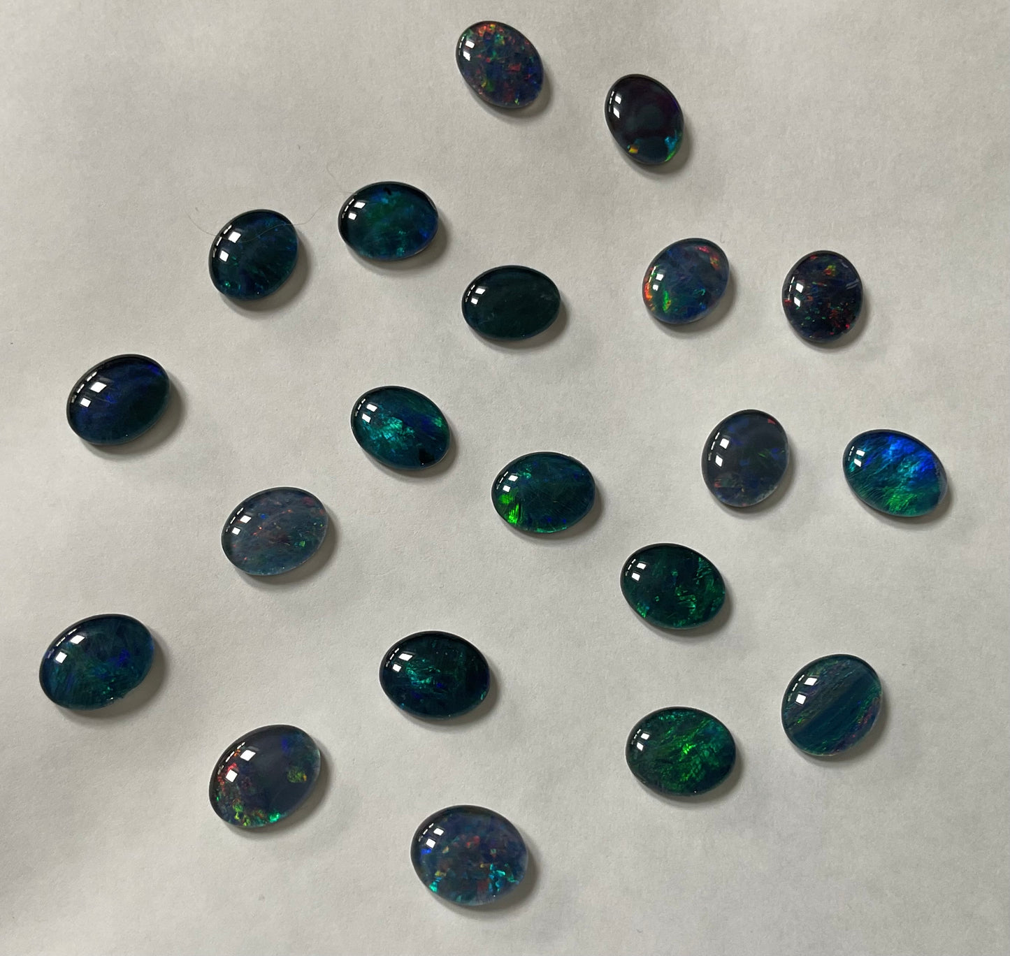 20 x triplet opal cabochons approximately 10x7mm flashes varied colours including reds greens yellows blues