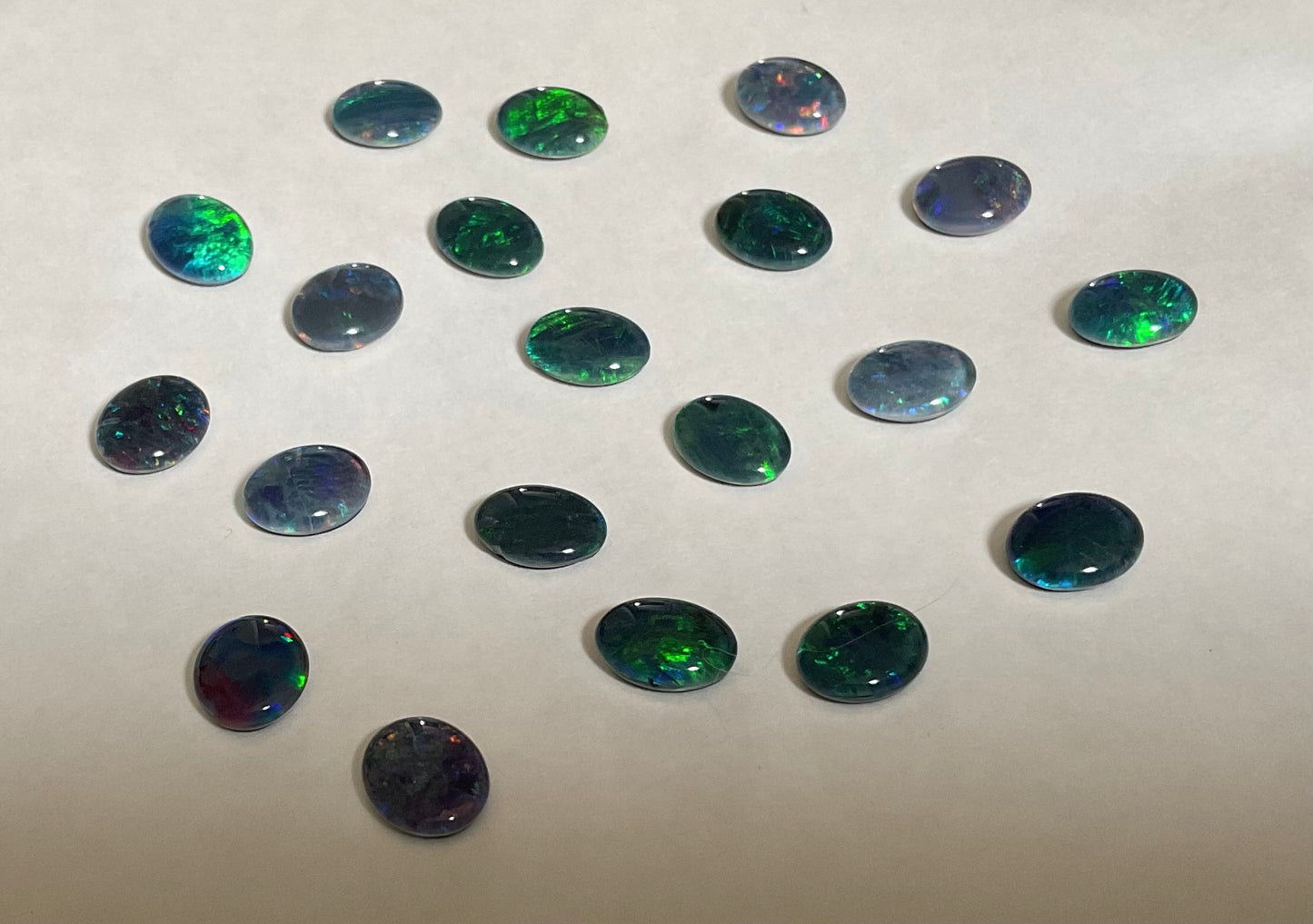20 x triplet opal cabochons approximately 10x7mm flashes varied colours including reds greens yellows blues