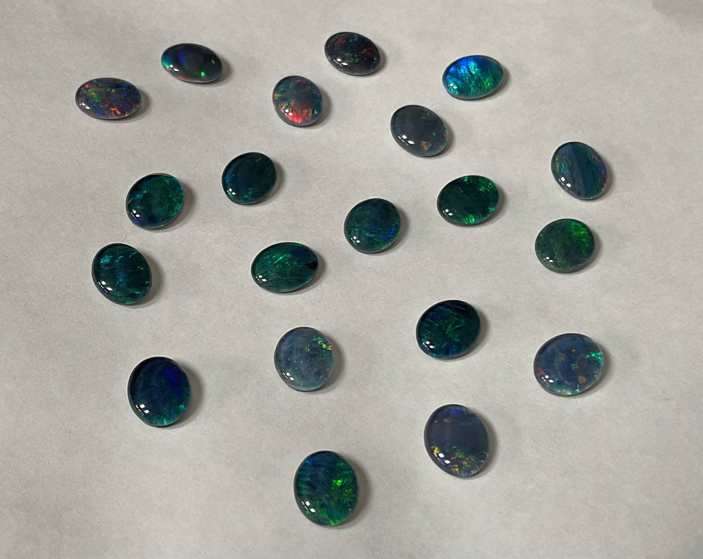 20 x triplet opal cabochons approximately 10x7mm flashes varied colours including reds greens yellows blues