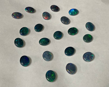 20 x triplet opal cabochons approximately 10x7mm flashes varied colours including reds greens yellows blues