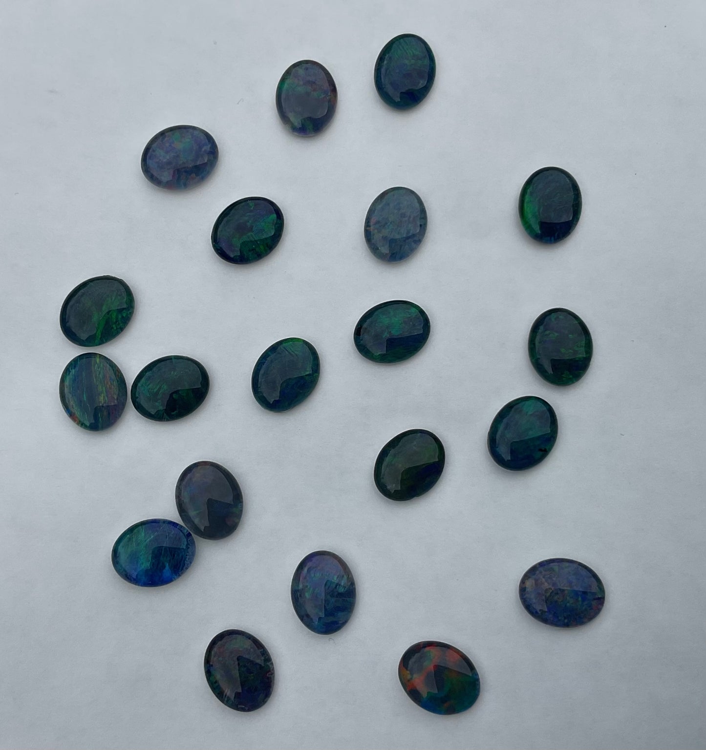 20 x triplet opal cabochons approximately 10x7mm flashes varied colours including reds greens yellows blues