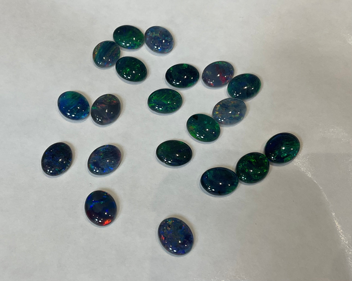 20 x triplet opal cabochons approximately 10x7mm flashes varied colours including reds greens yellows blues