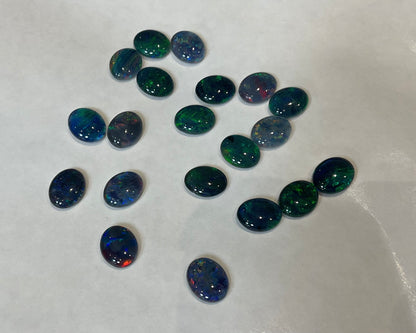 20 x triplet opal cabochons approximately 10x7mm flashes varied colours including reds greens yellows blues