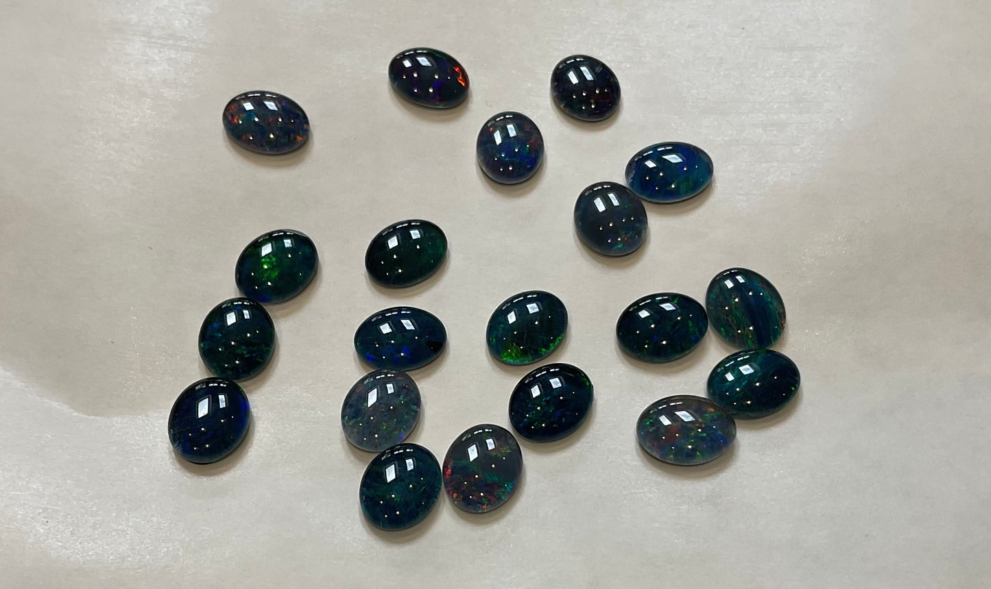 20 x triplet opal cabochons approximately 10x7mm flashes varied colours including reds greens yellows blues