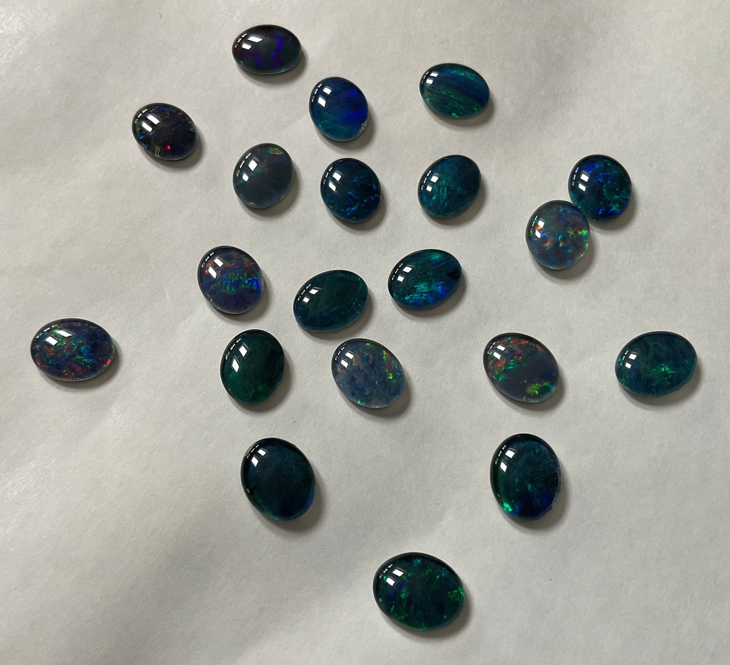 20 x triplet opal cabochons approximately 10x7mm flashes varied colours including reds greens yellows blues