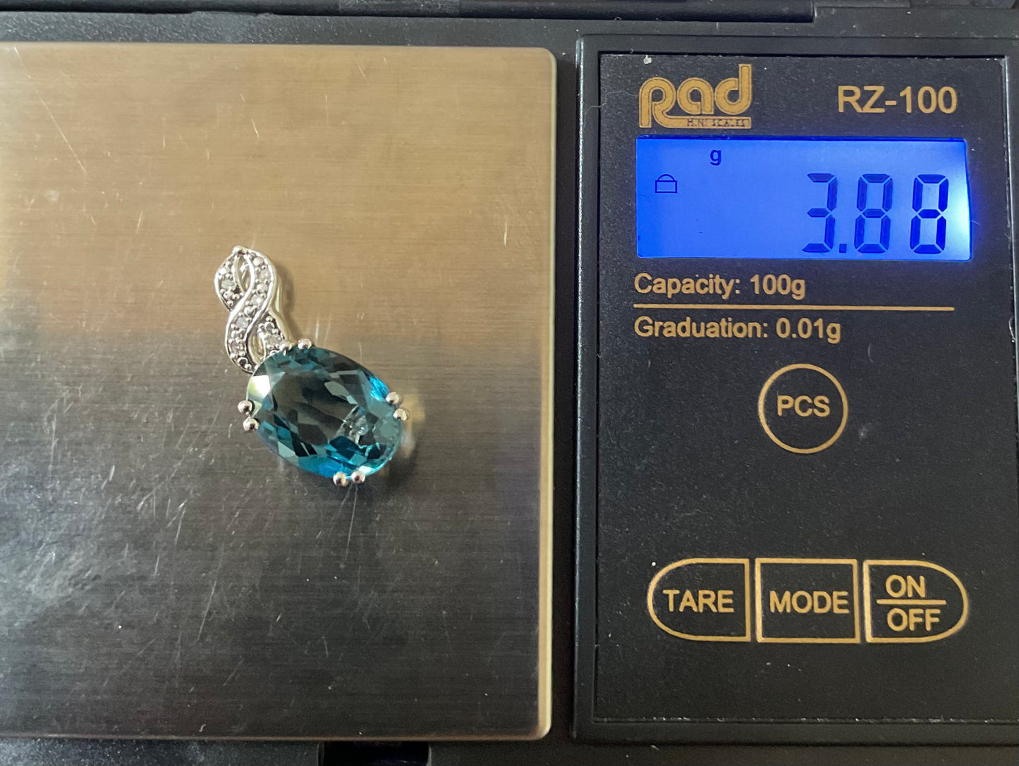 10K Oval 14x10mm London Blue Topaz and Diamond pendant (no chain) white gold TGGC