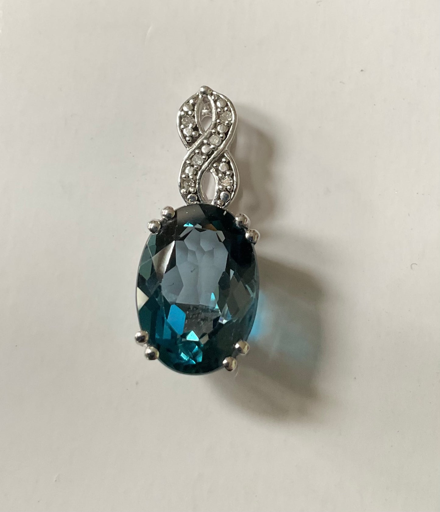 10K Oval 14x10mm London Blue Topaz and Diamond pendant (no chain) white gold TGGC