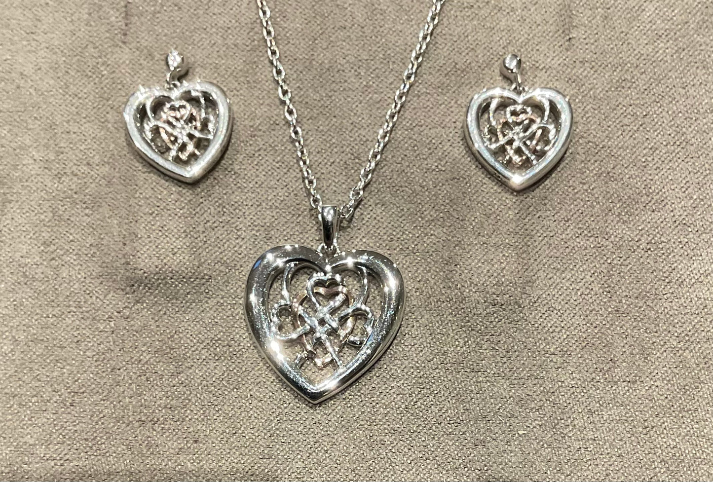 Clogau Welsh Royalty Heart pendant necklace and earrings set in silver and rose gold
