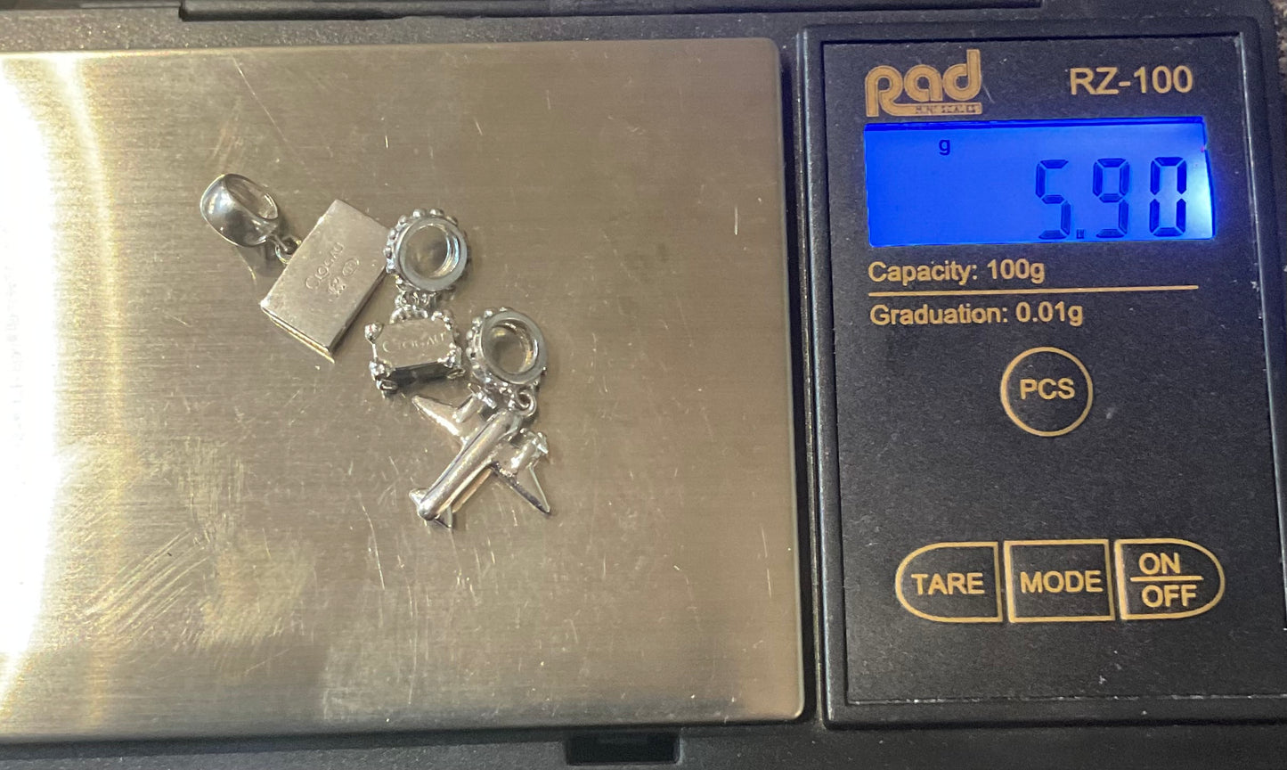 Clogau Suitcase, Postcard and Aeroplane Milestones charms in Silver and rose gold