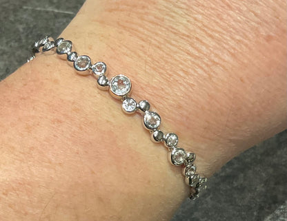 Clogau Celebration White Topaz bangle bracelet in silver and rose gold