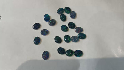 20 x triplet opal cabochons approximately 10x7mm flashes varied colours including reds greens yellows blues