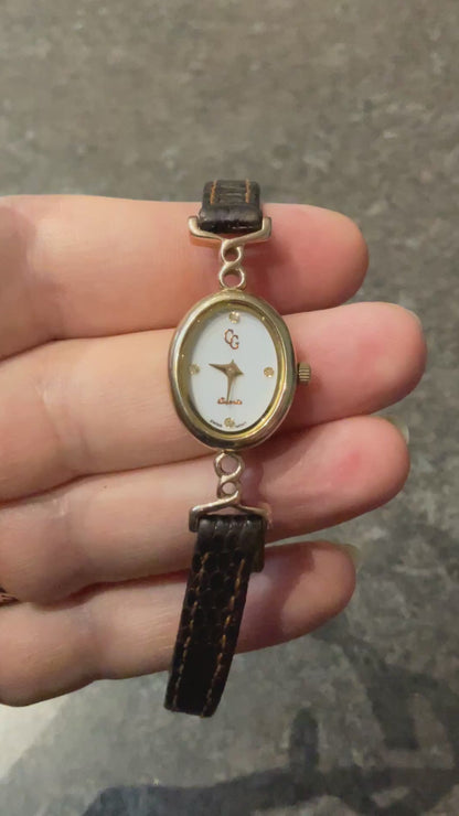 Ladies Clogau 9ct Diamond accent watch with original brown leather strap in yellow and rose gold new battery working