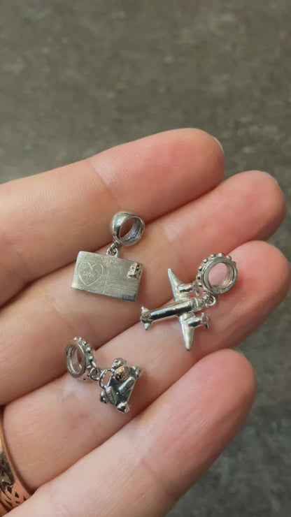 Clogau Suitcase, Postcard and Aeroplane Milestones charms in Silver and rose gold